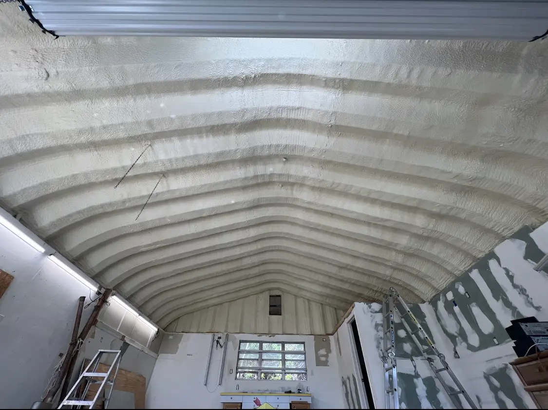 Spray polyurethane foam applied to the underside of a metal roof deck in Bayville