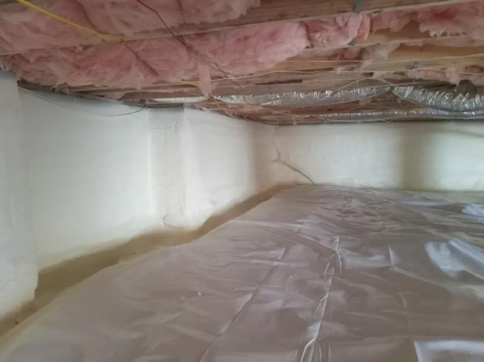 Crawl space encapsulation with closed-cell spray foam for Storm Damage Roof Repair in Bayville